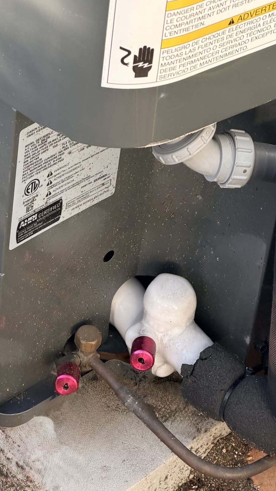 Frozen suction line and iced refrigerant service valve causing AC freezing issue during HVAC diagnosis in South Jersey.