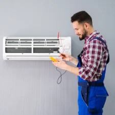 HVAC Tech installing a wall unit